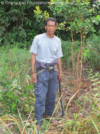 Pak Majid working on his garden at Camp Rendell.